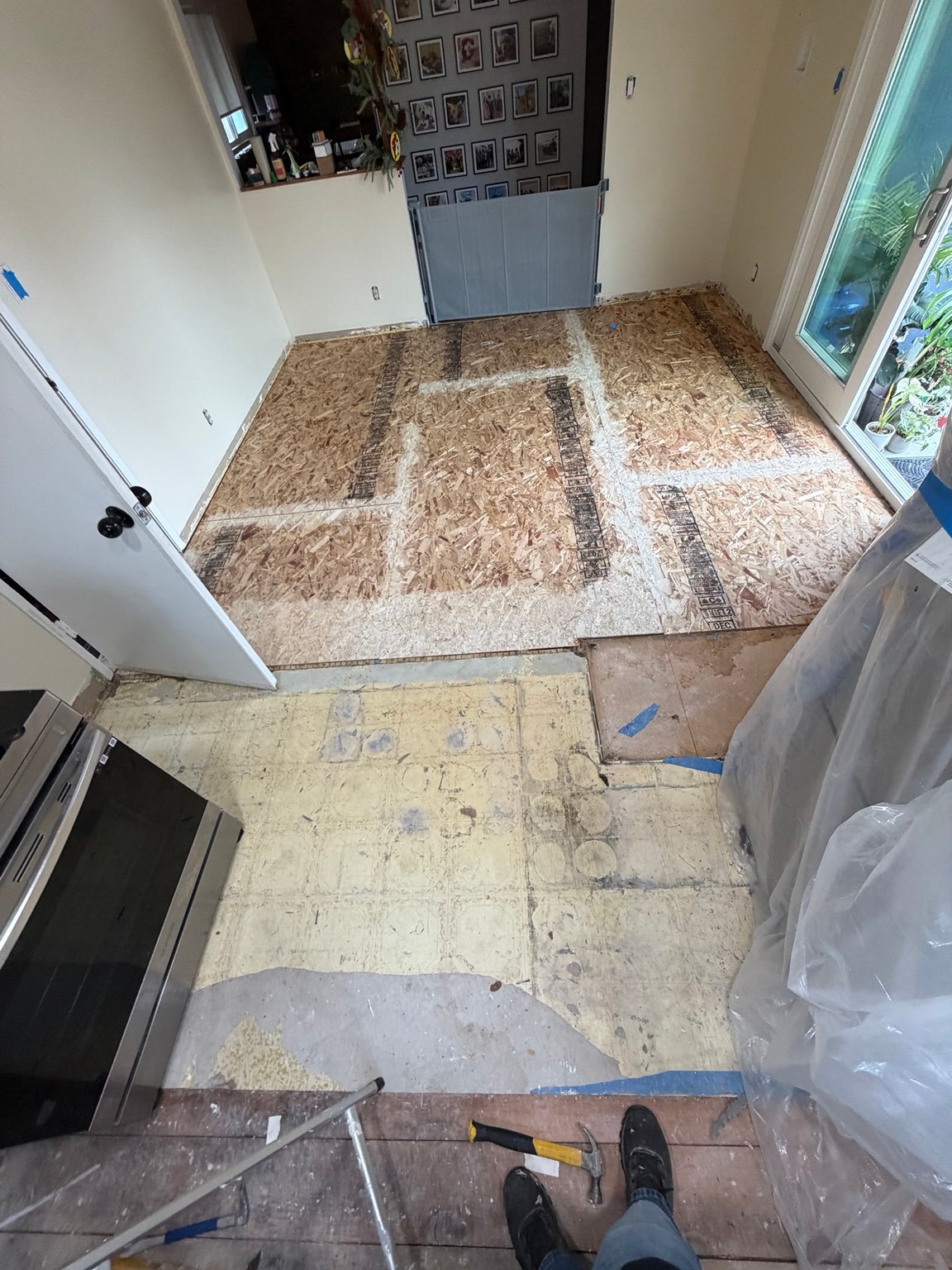 Kitchen renovation with subfloor preparation in progress