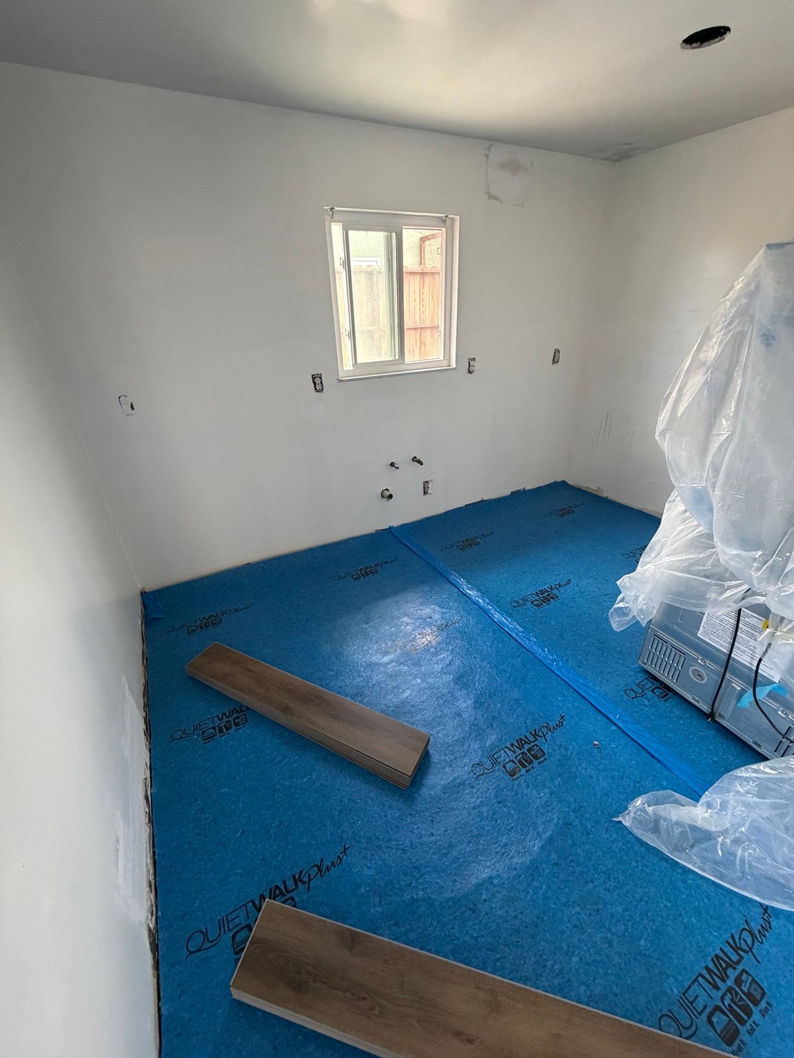 Floor underlayment installed before new kitchen flooring